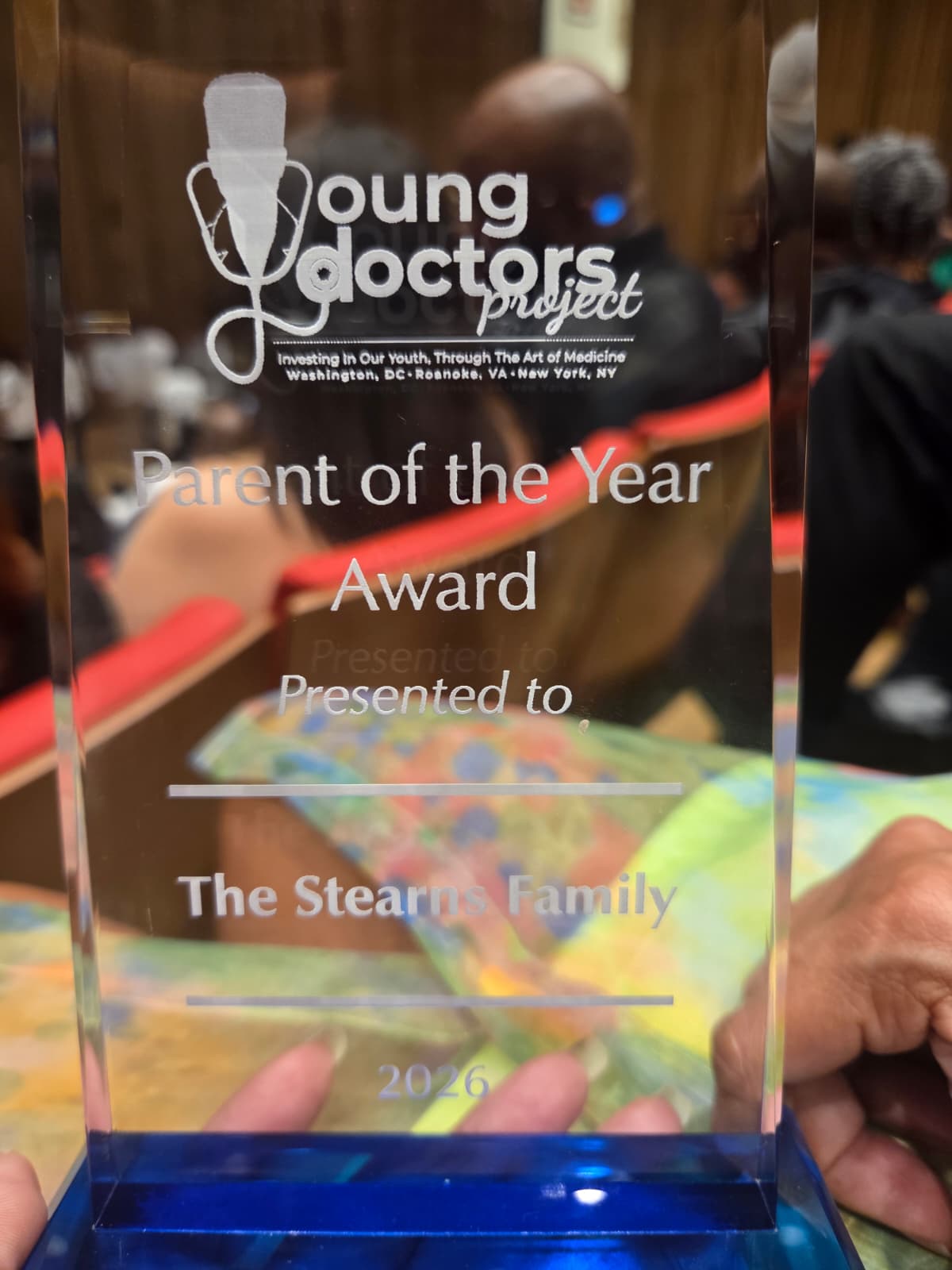 Close-up of the Young Doctors Project Parent of the Year Award presented to the Stearns Family
